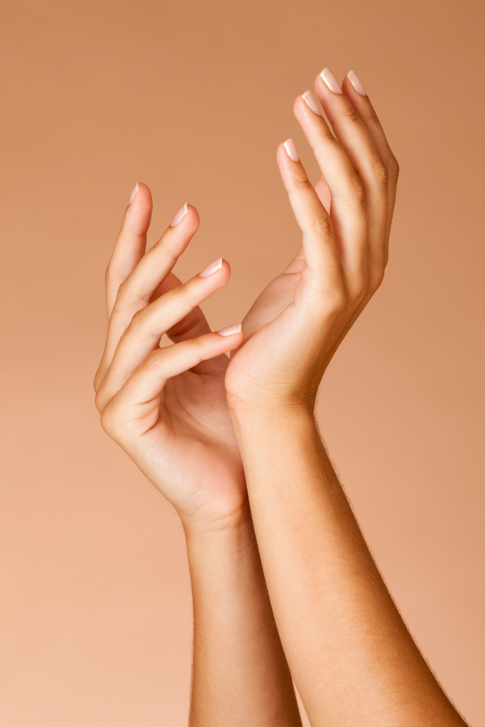 Close-up of manicured hands showing classic, gel, and structured manicure finishes at Sublime Salon & Spa in Newtown, Pennsylvania